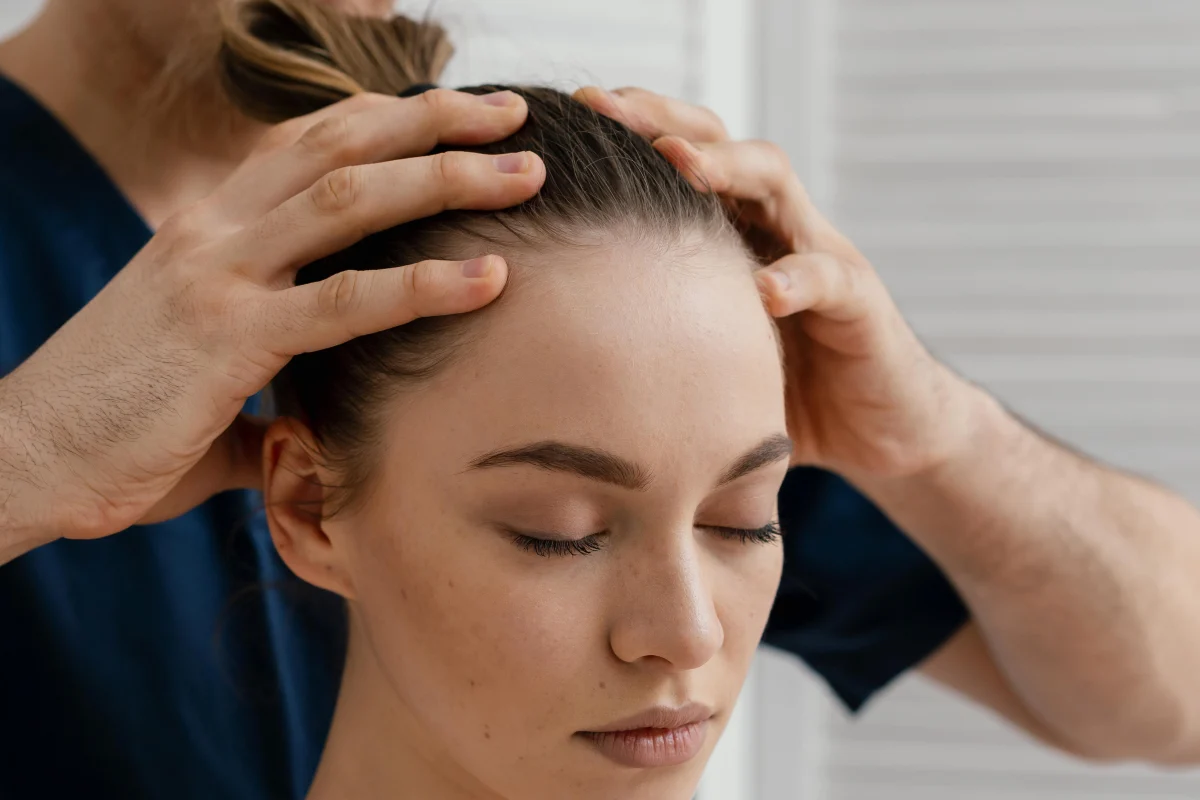 Close-up of a scalp massage during a salon appointment